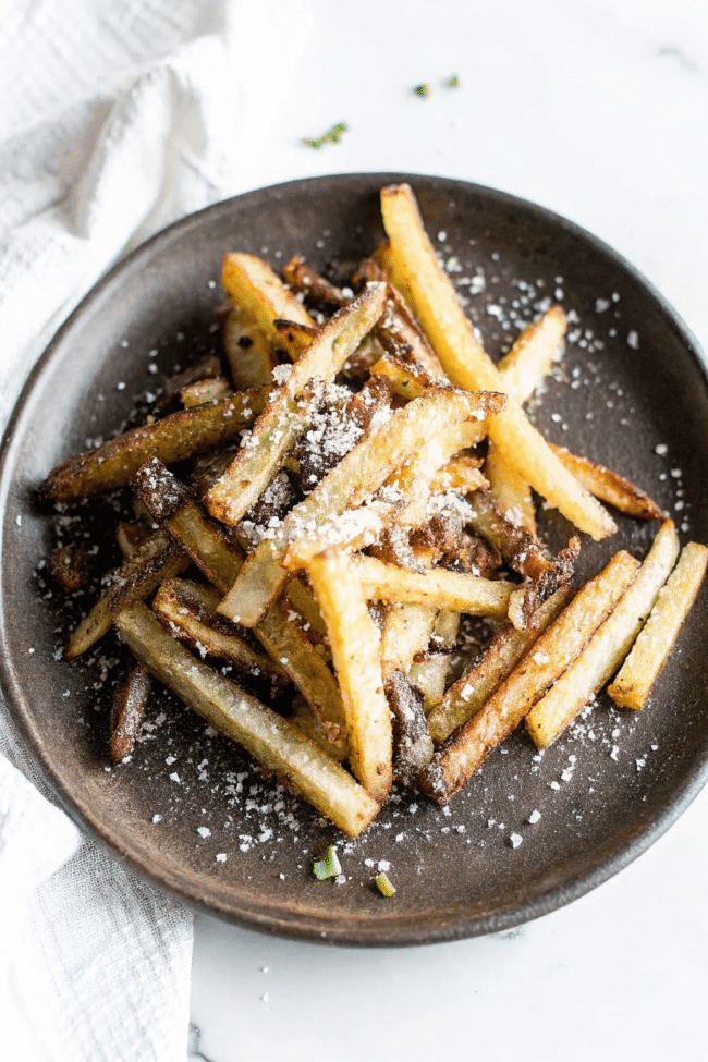 Truffle fries with a golden crust and sprinkled with fresh herbs