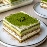 Layered Matcha tiramisu with green tea and mascarpone, dusted with matcha powder